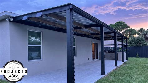 metal pergola with roof attached to house|installing metal roof on pergola.